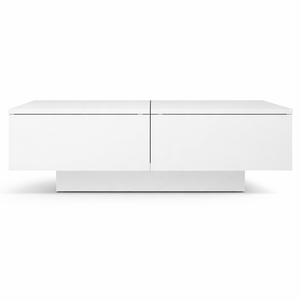Table basse salon blanche vue de face, style minimaliste avec volumes équilibrés et rangement discret.